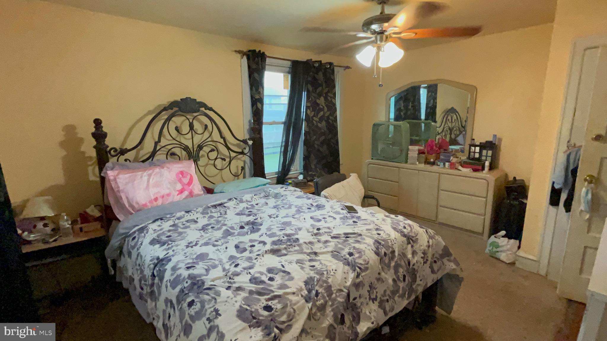 800 Bullock Avenue Lansdowne, PA 19050 - Photo 12 of 19 a bedroom with a bed and dresser with mirror