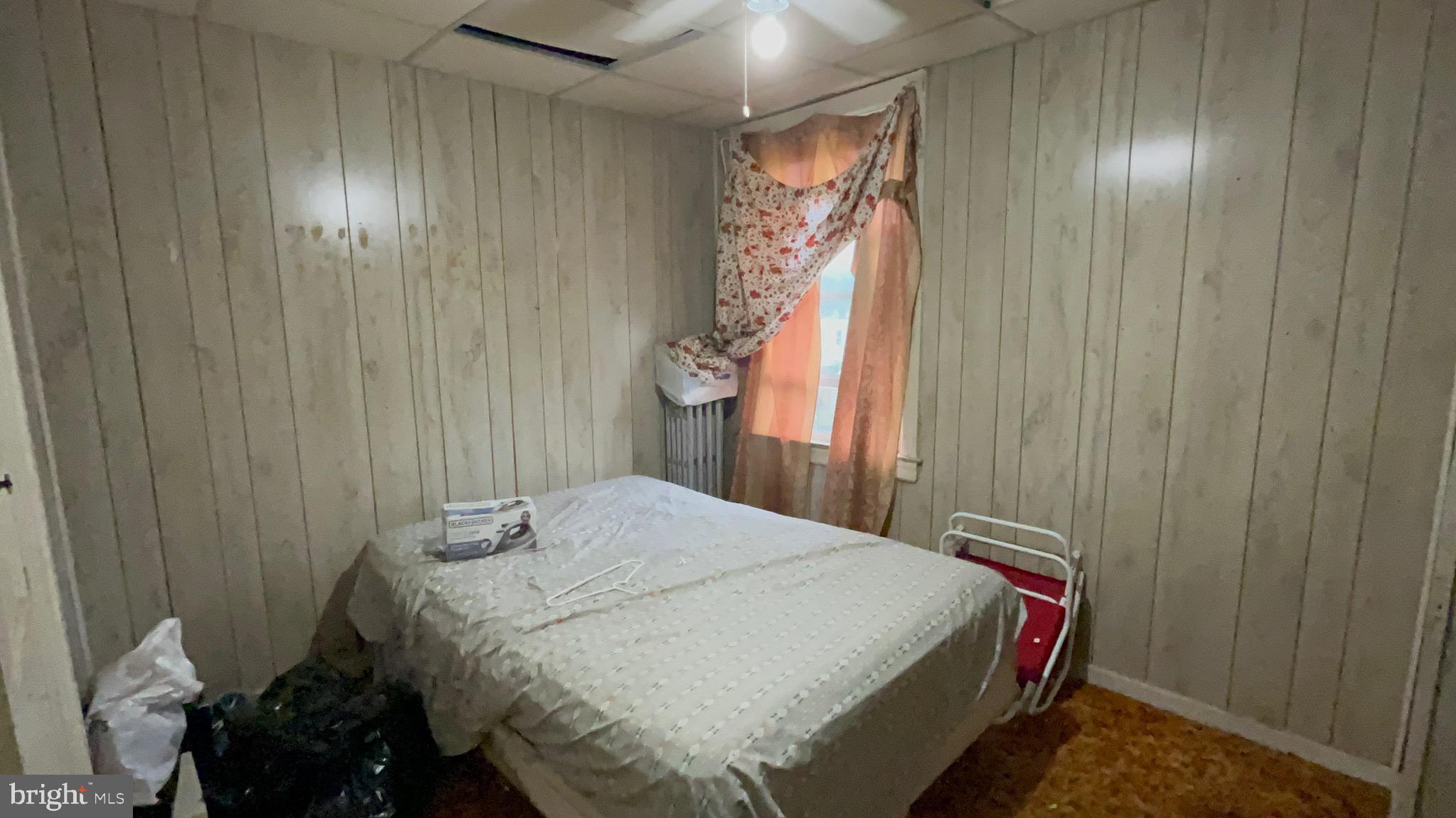 800 Bullock Avenue Lansdowne, PA 19050 - Photo 13 of 19 a bedroom with a bed and a chandelier