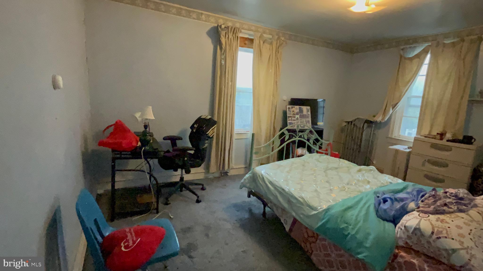 800 Bullock Avenue Lansdowne, PA 19050 - Photo 14 of 19 a bed room with a bed and a chair