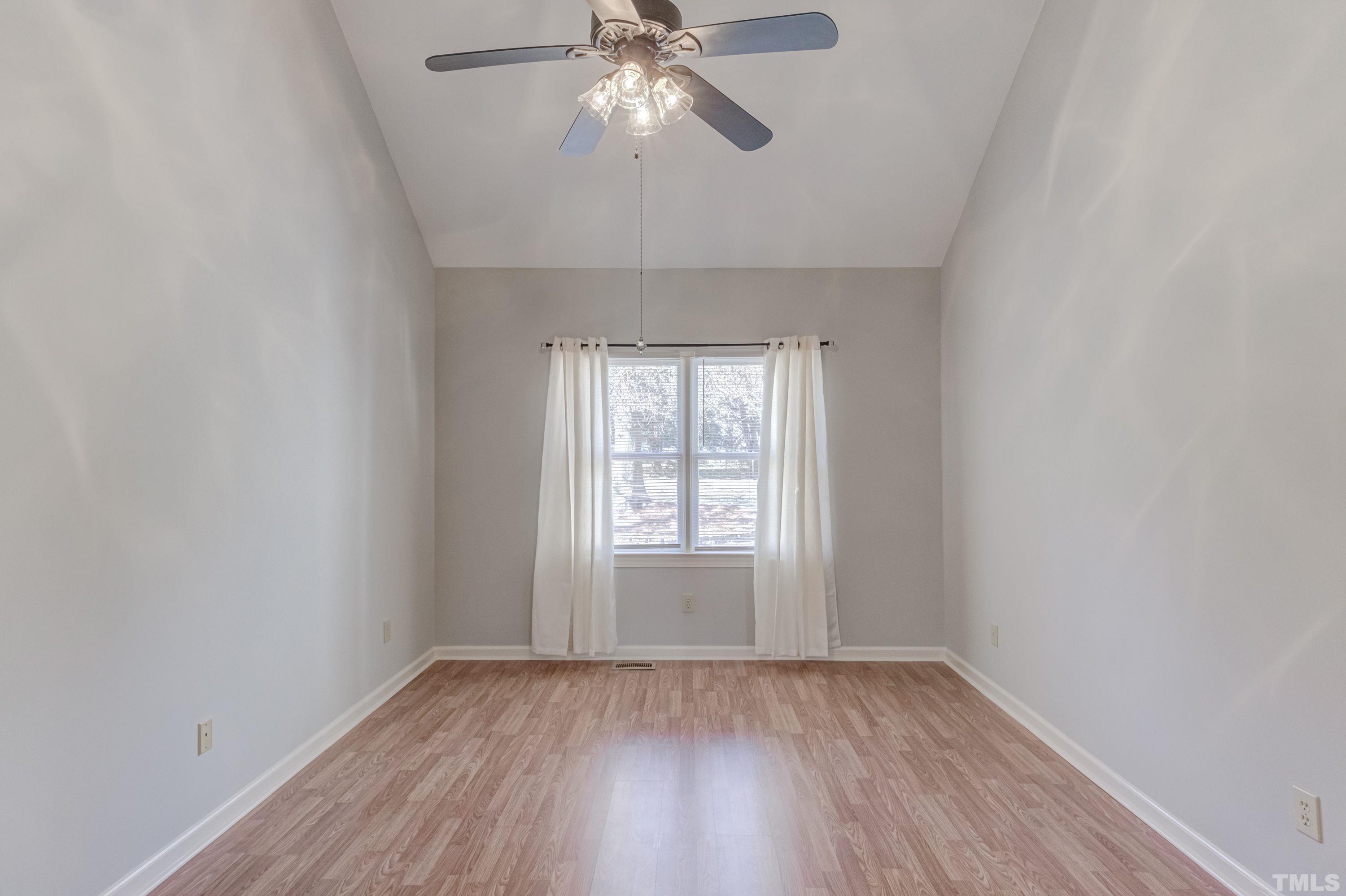 9305 Tallgrass Road Raleigh, NC 27603 - Photo 27 of 49 wooden floor in an empty room with a window