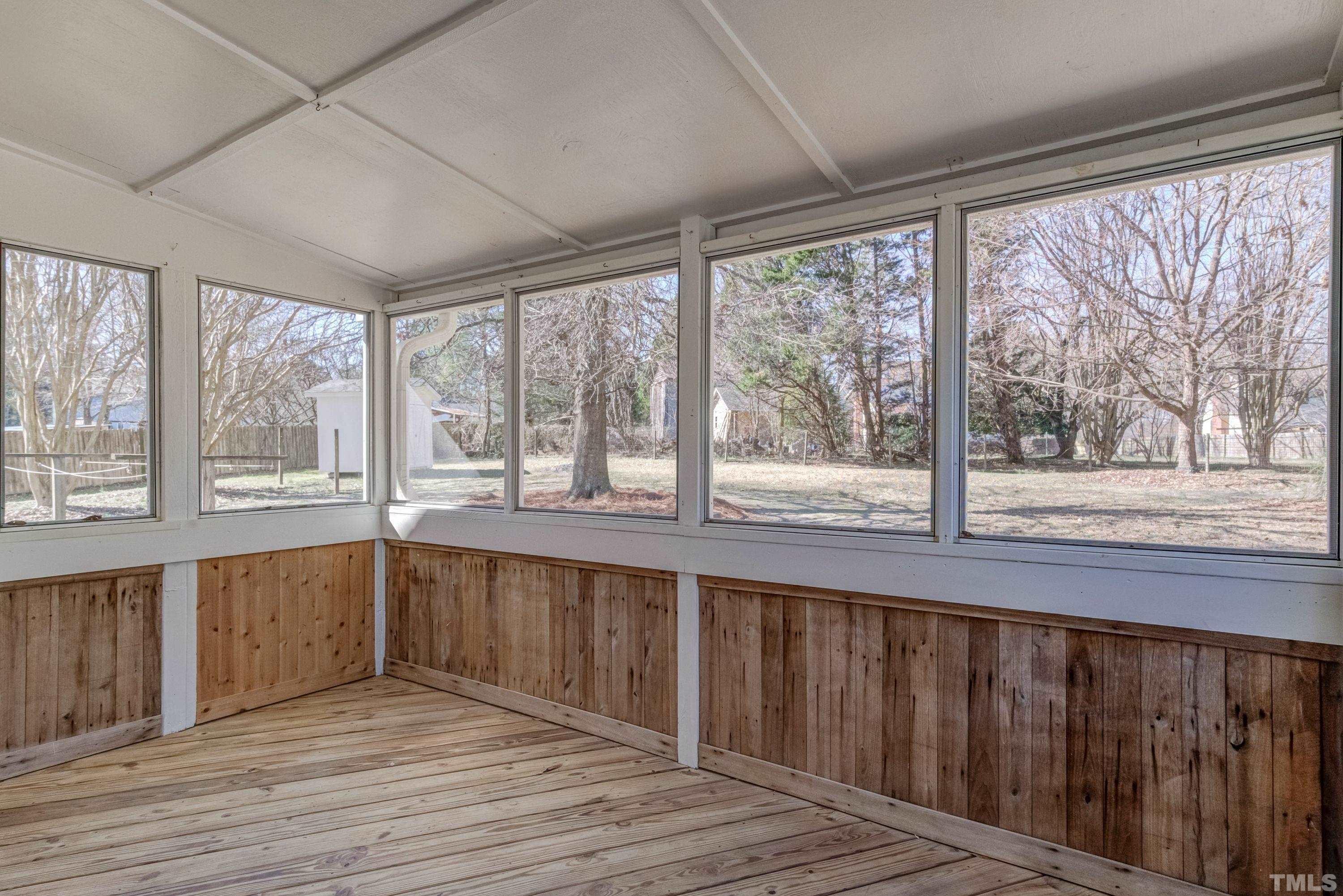 9305 Tallgrass Road Raleigh, NC 27603 - Photo 35 of 49 a view of a kitchen with wooden floor and a large window