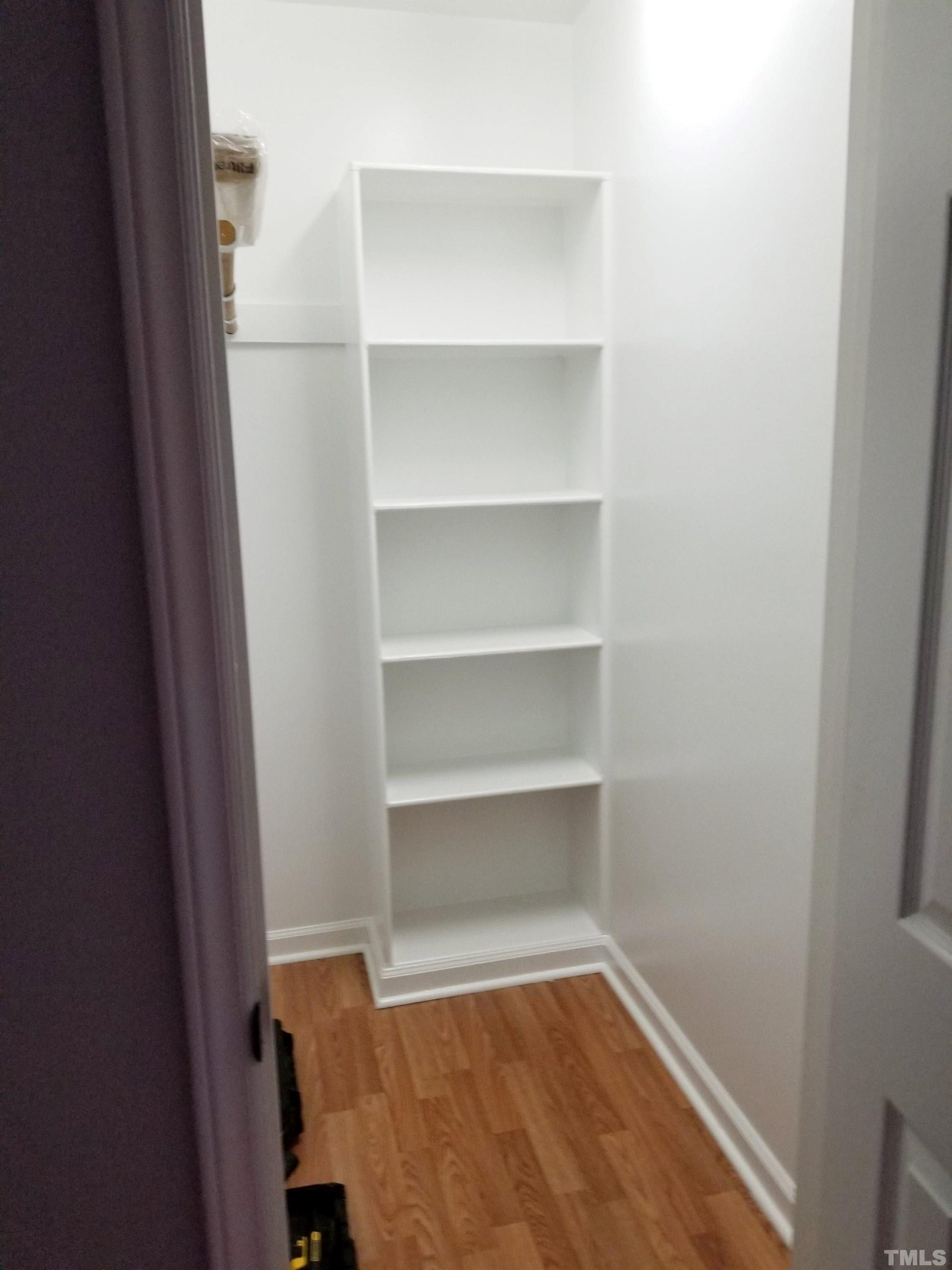 9305 Tallgrass Road Raleigh, NC 27603 - Photo 39 of 49 a view of a room with shelf