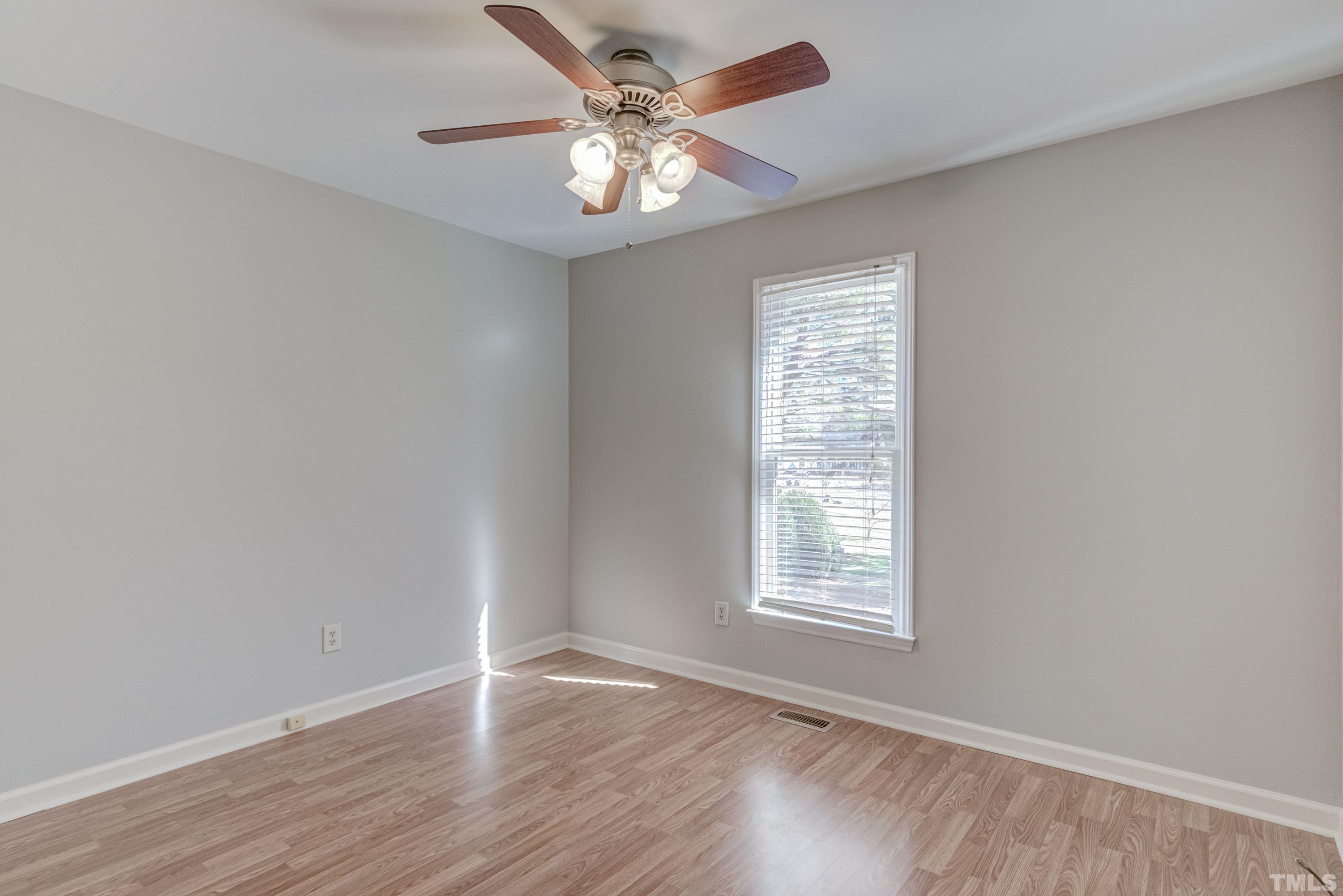 9305 Tallgrass Road Raleigh, NC 27603 - Photo 41 of 49 wooden floor in an empty room with a window