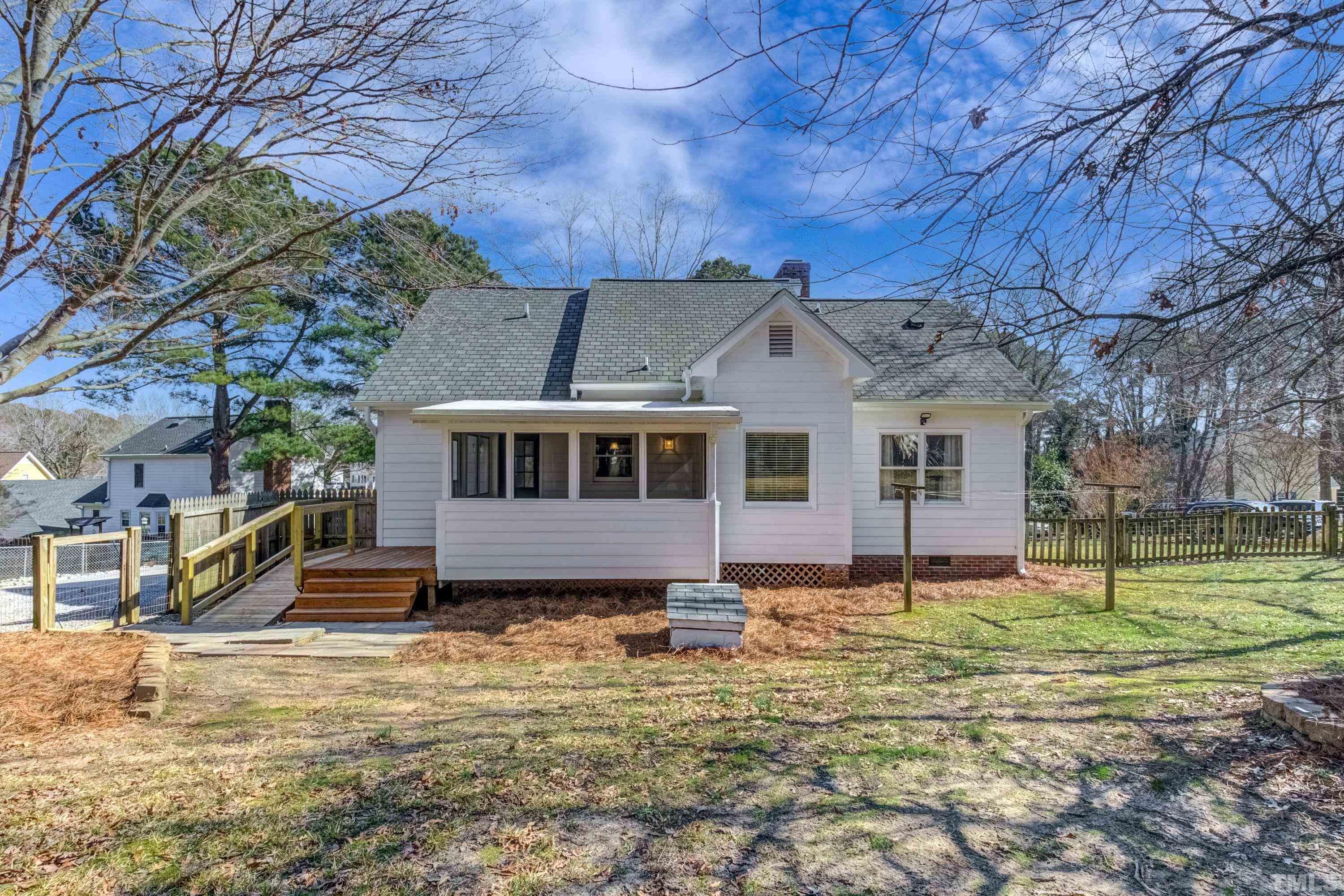 9305 Tallgrass Road Raleigh, NC 27603 - Photo 46 of 49 a front view of a house with a yard