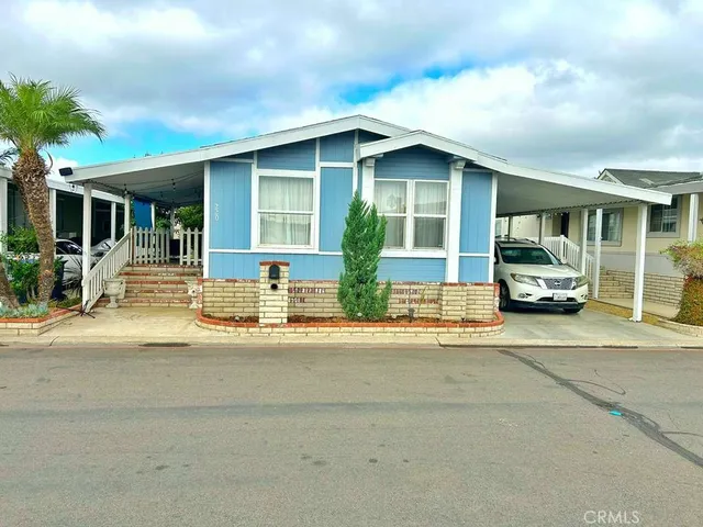 a front view of a house with parking