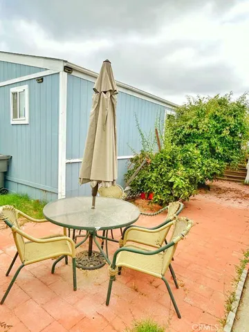 a table and chairs in a patio