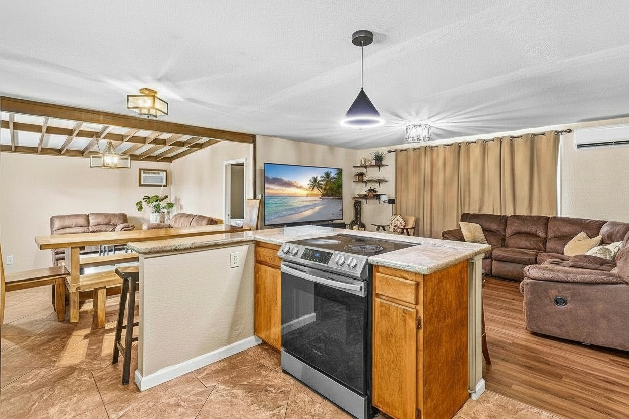 4806 Iiwi Road Kapaa, HI 96746 - Photo 16 of 30 a kitchen with a stove and a sink