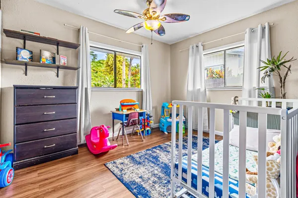 a bedroom with a bed and a book shelf
