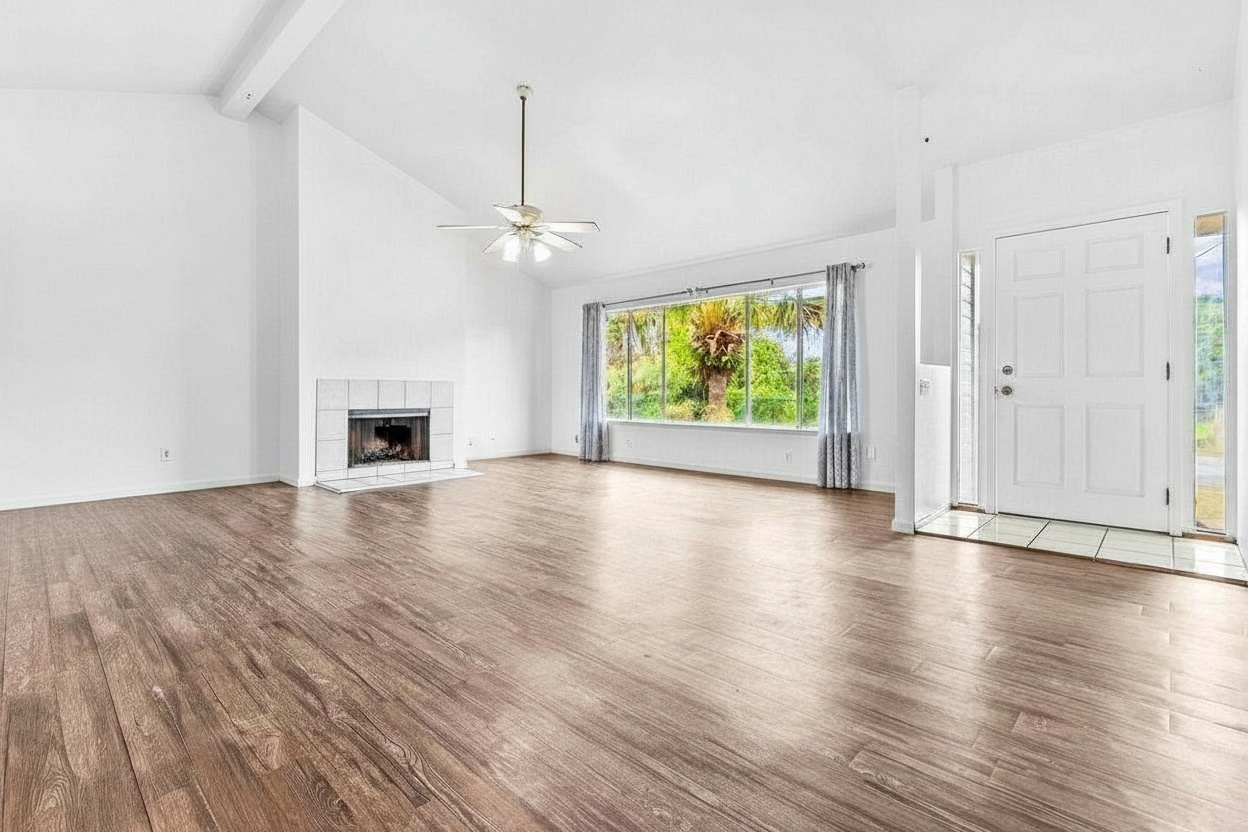 4806 Iiwi Road Kapaa, HI 96746 - Photo 2 of 30 an empty room with wooden floor fireplace and windows