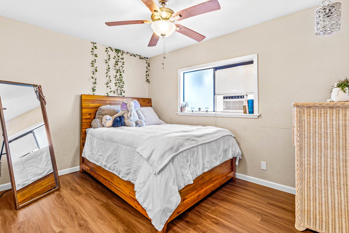 4806 Iiwi Road Kapaa, HI 96746 - Photo 21 of 30 a bedroom with a bed and a window