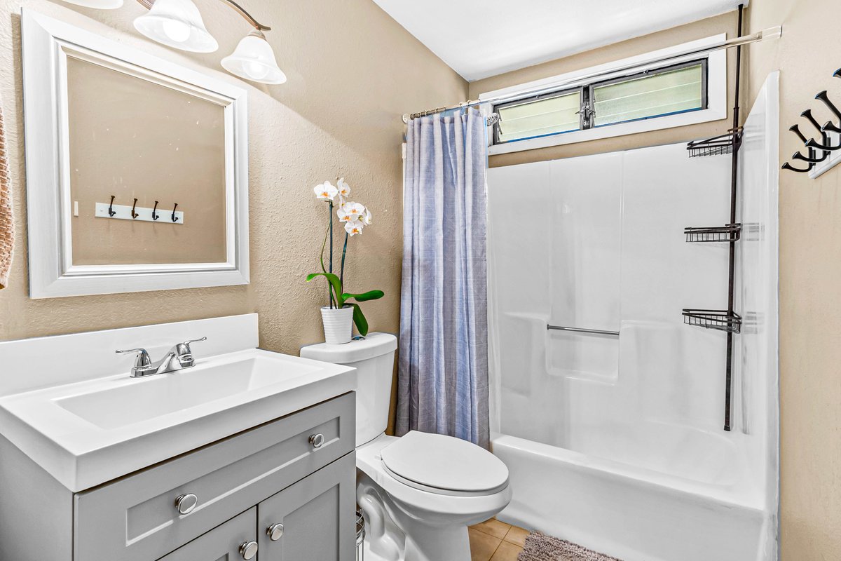4806 Iiwi Road Kapaa, HI 96746 - Photo 23 of 30 a bathroom with a sink toilet and shower