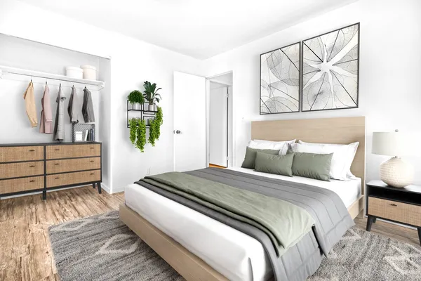 a bedroom with a bed and a painting on the wall