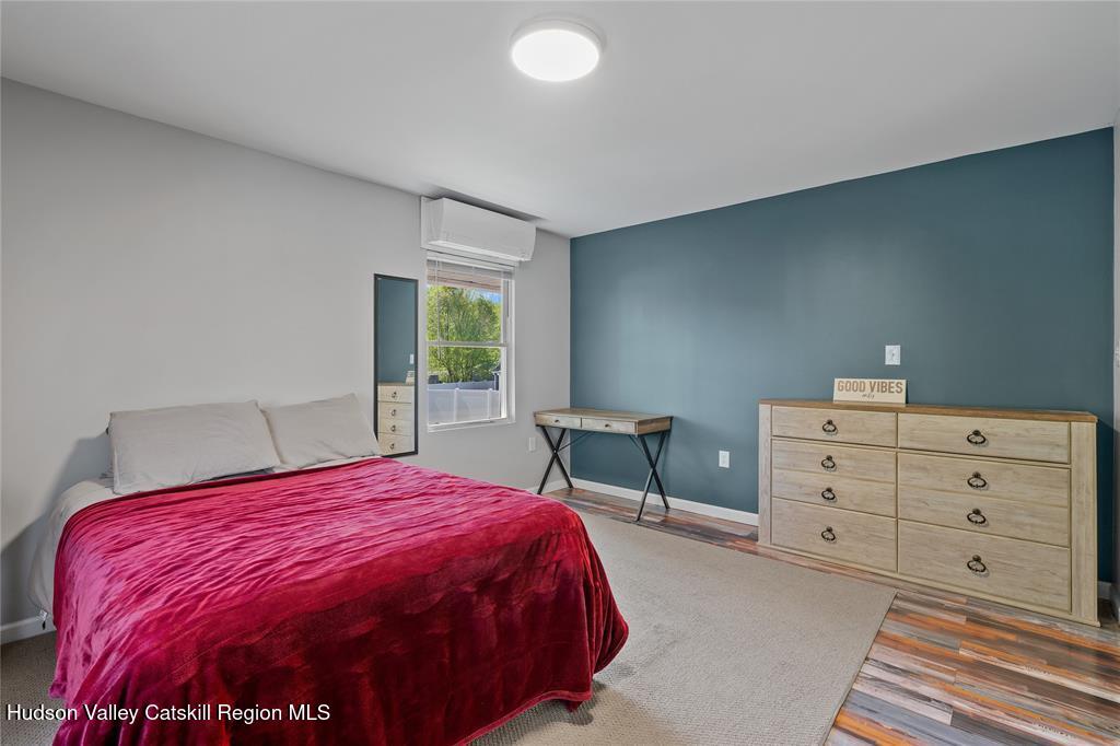 69 Mossybrook Road High Falls, NY 12440 - Photo 12 of 36 a spacious bedroom with a bed and a window