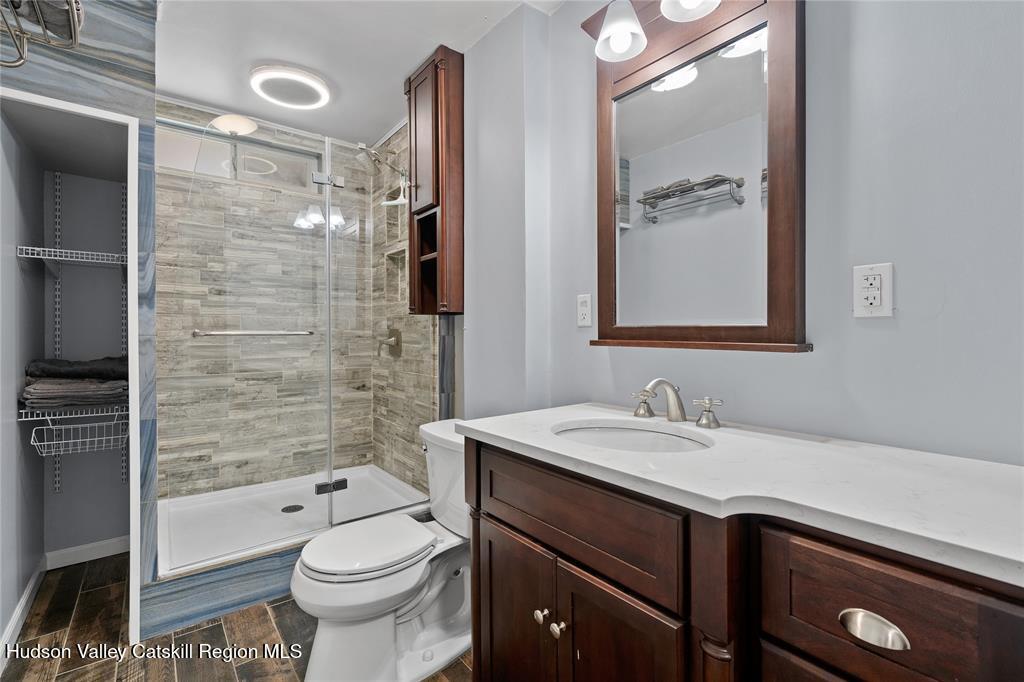 69 Mossybrook Road High Falls, NY 12440 - Photo 14 of 36 a bathroom with a sink a toilet and shower