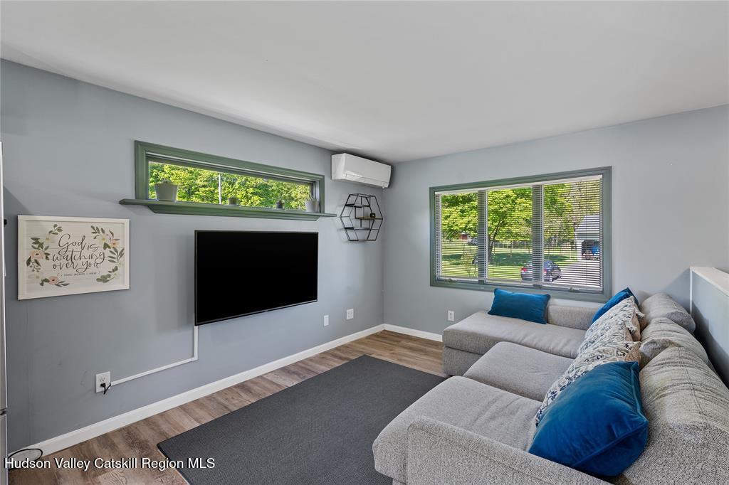 69 Mossybrook Road High Falls, NY 12440 - Photo 9 of 36 a living room with furniture and a flat screen tv