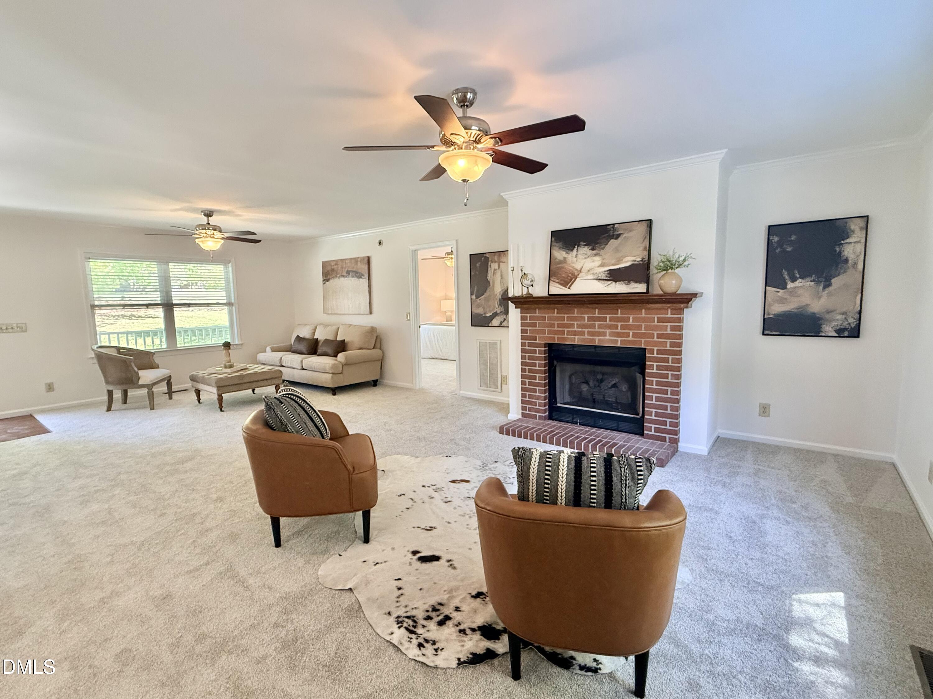 2429 Halifax Road Roxboro, NC 27573 - Photo 4 of 54 a living room with furniture and a fireplace
