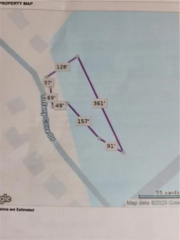 a view of entryway and kitchen