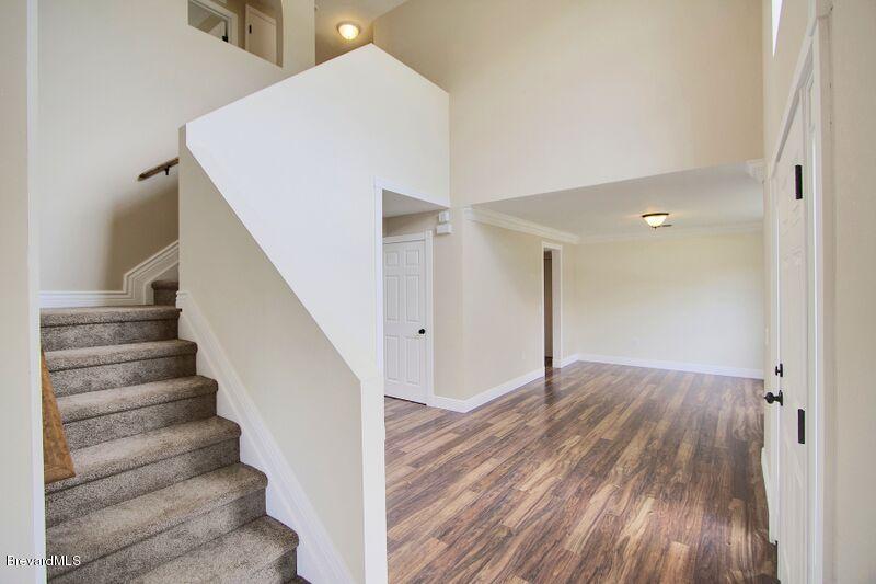 2139 Watkins Road Southeast Palm Bay, FL 32909 - Photo 15 of 32 a view of entryway with wooden floor