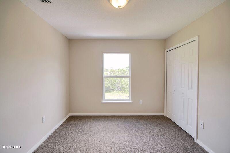 2139 Watkins Road Southeast Palm Bay, FL 32909 - Photo 23 of 32 a view of a window in an empty room