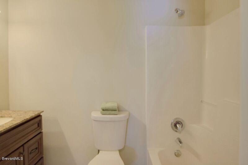 2139 Watkins Road Southeast Palm Bay, FL 32909 - Photo 24 of 32 a bathroom with a toilet and a shower