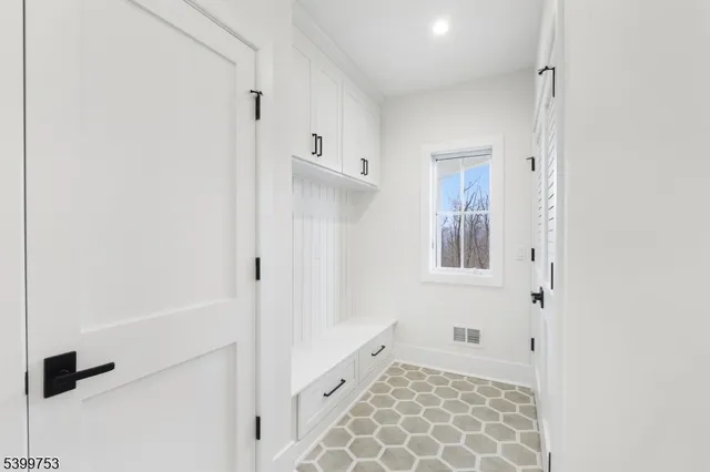 a bathroom with a granite countertop sink mirror and