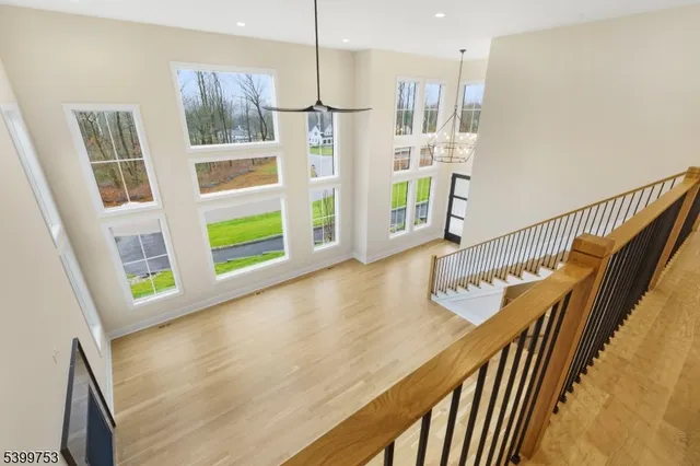 a view of a kitchen with furniture and wooden floor