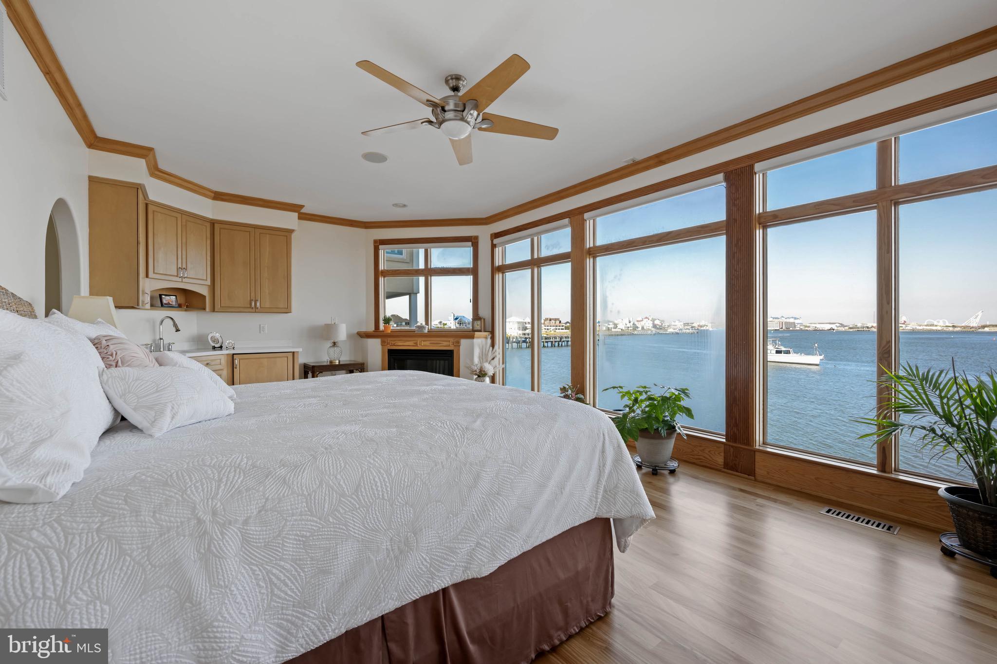 12959 Harbor Road Ocean City, MD 21842 - Photo 23 of 85 a spacious bedroom with a large bed and a large window with outer view