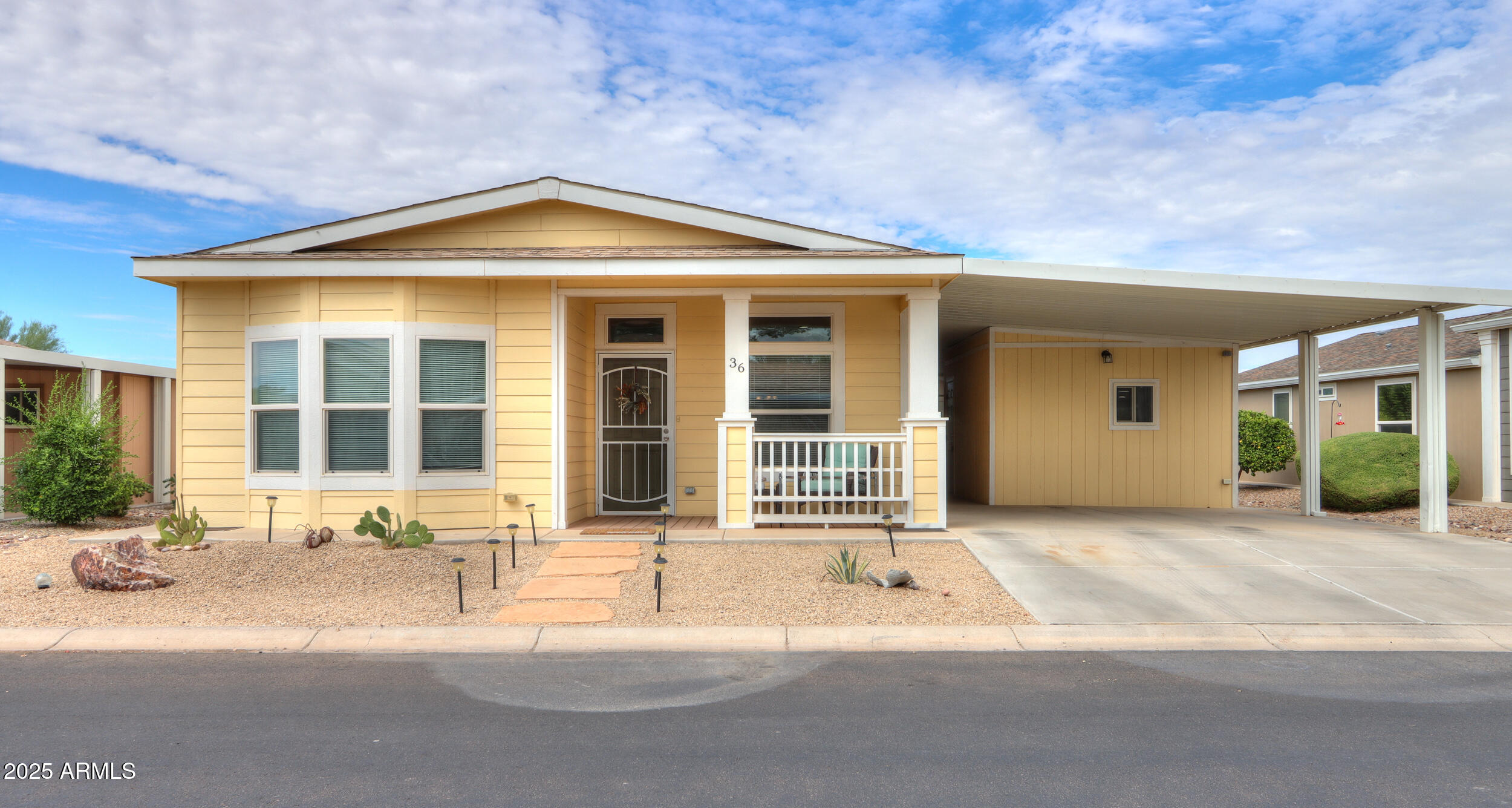 2263 North Trekell Road, Unit 36 Casa Grande, AZ 85122 - Photo 1 of 53 a front view of a house with a yard