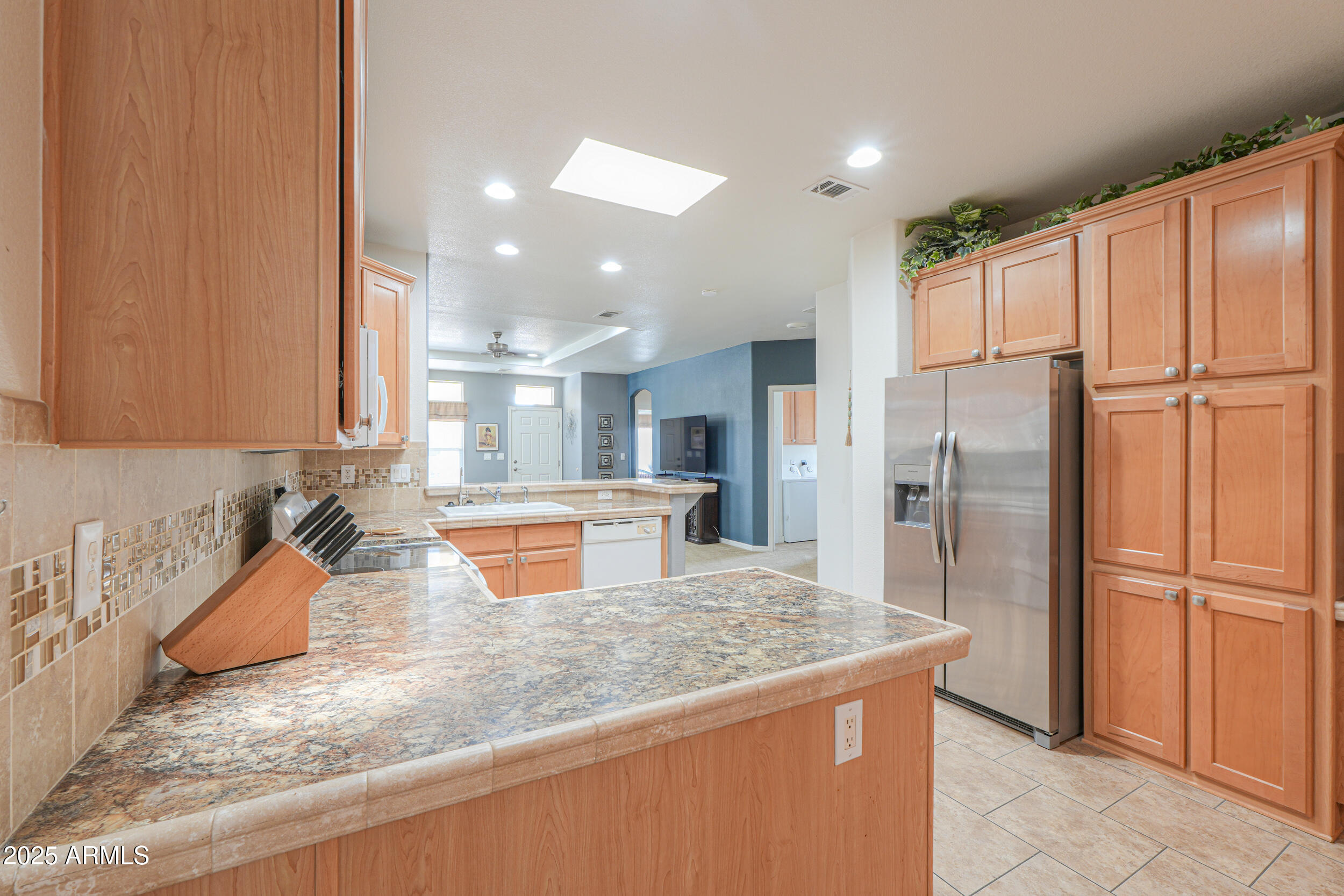 2263 North Trekell Road, Unit 36 Casa Grande, AZ 85122 - Photo 13 of 53 a kitchen with stainless steel appliances granite countertop a refrigerator a oven and a sink