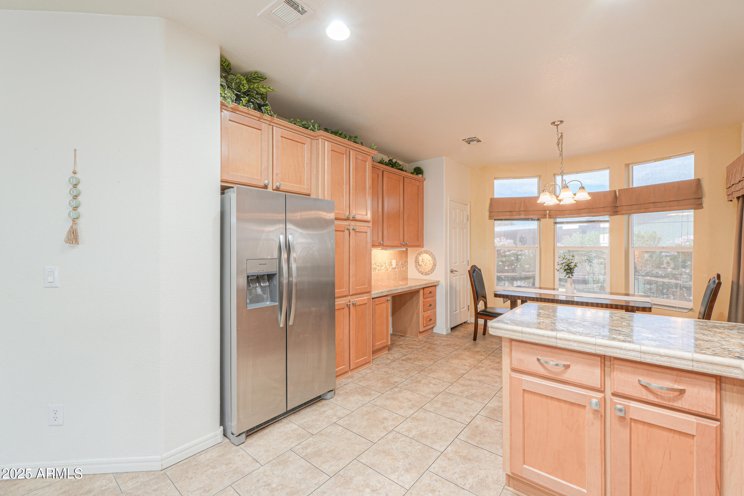2263 North Trekell Road, Unit 36 Casa Grande, AZ 85122 - Photo 14 of 53 a kitchen with granite countertop a refrigerator and a sink