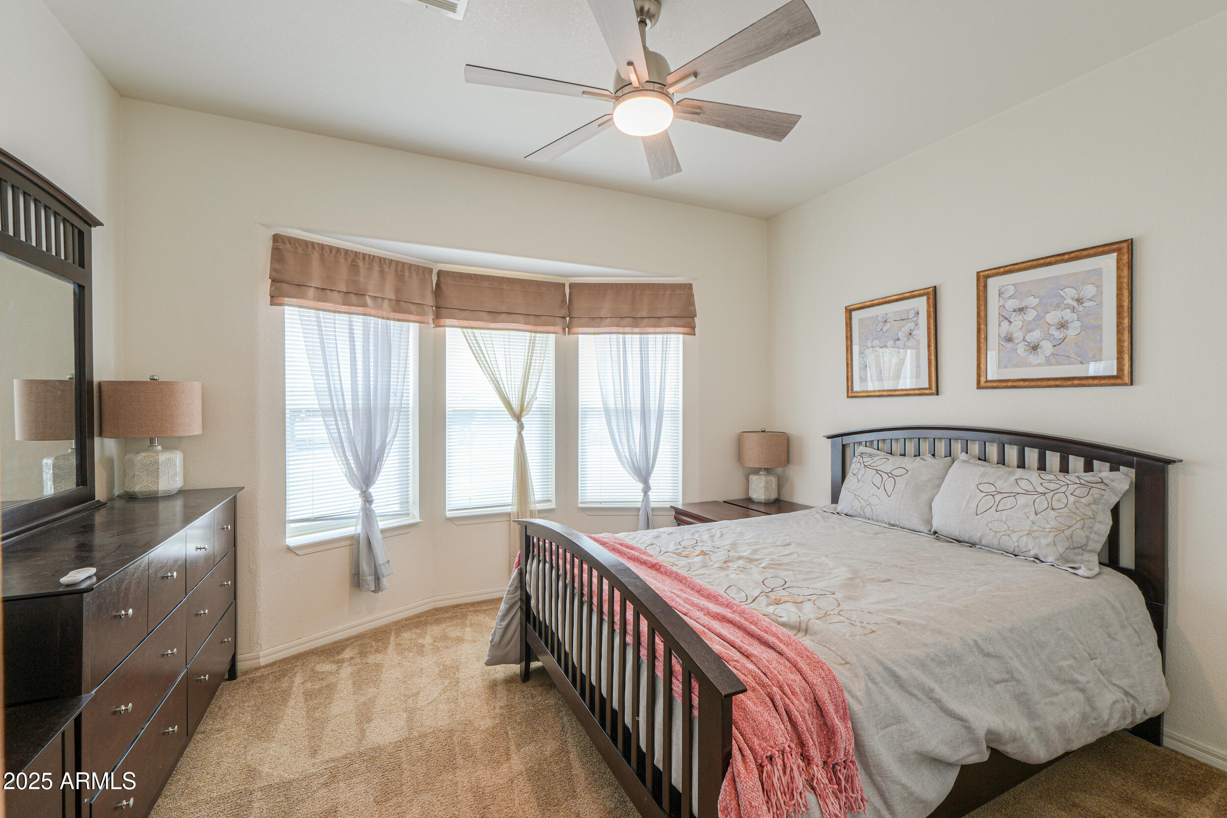 2263 North Trekell Road, Unit 36 Casa Grande, AZ 85122 - Photo 18 of 53 a bedroom with a large bed and a window