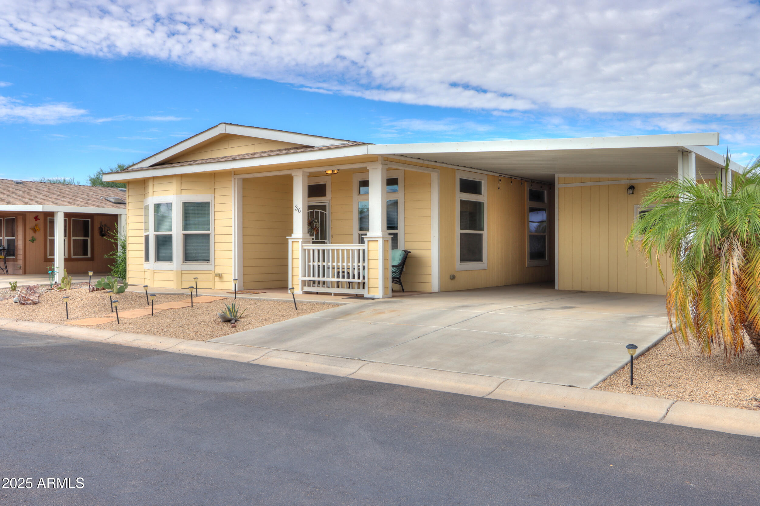 2263 North Trekell Road, Unit 36 Casa Grande, AZ 85122 - Photo 2 of 53 a view of a house with backyard and porch