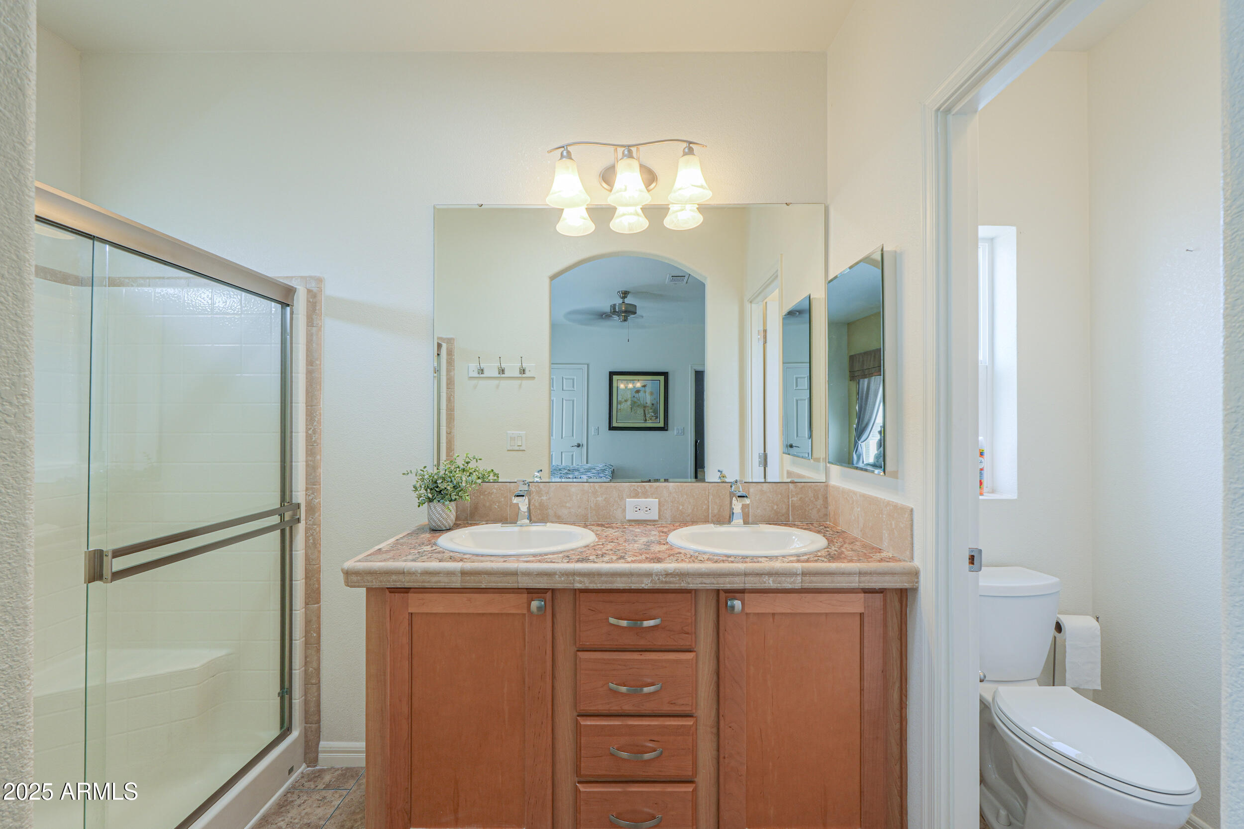 2263 North Trekell Road, Unit 36 Casa Grande, AZ 85122 - Photo 24 of 53 a bathroom with a granite countertop sink a toilet and a mirror