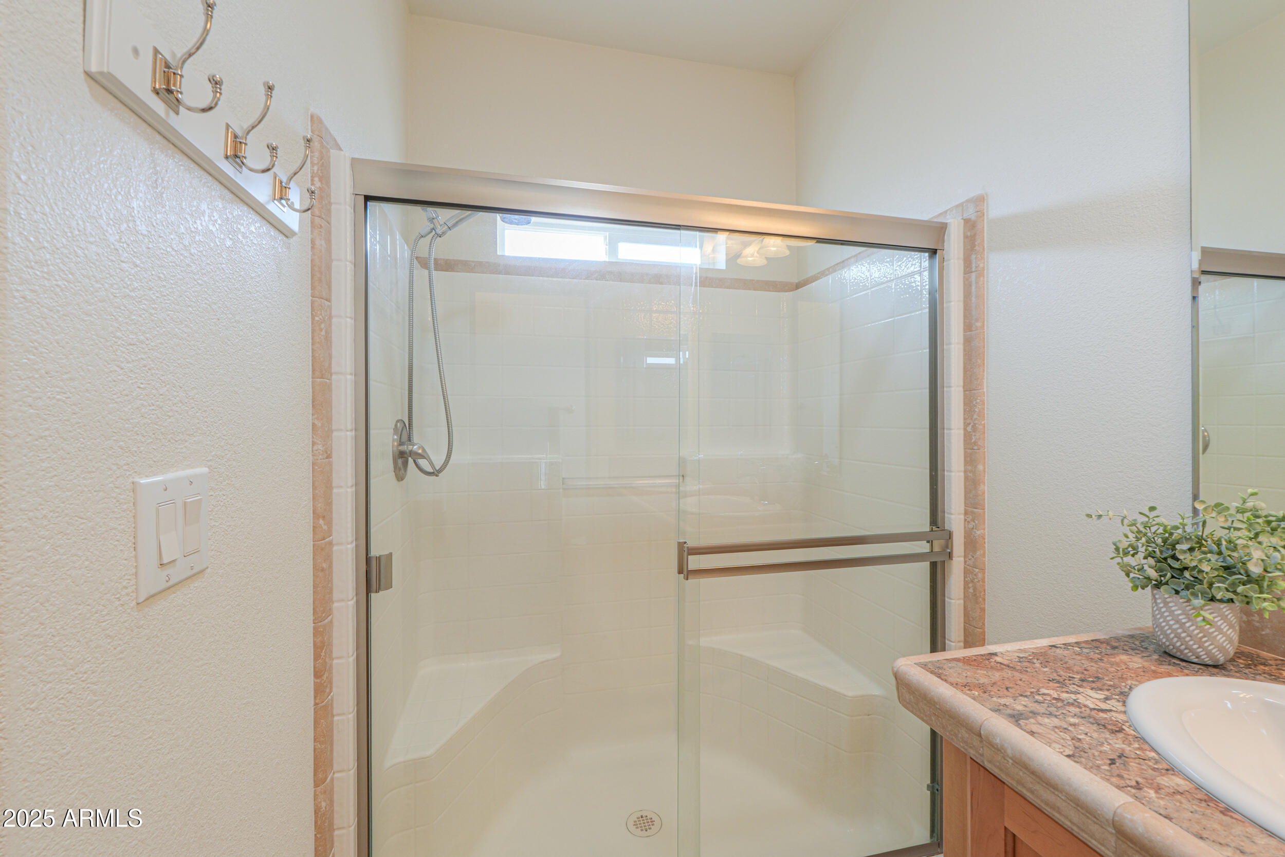 2263 North Trekell Road, Unit 36 Casa Grande, AZ 85122 - Photo 25 of 53 a bathroom with a granite countertop shower and a sink