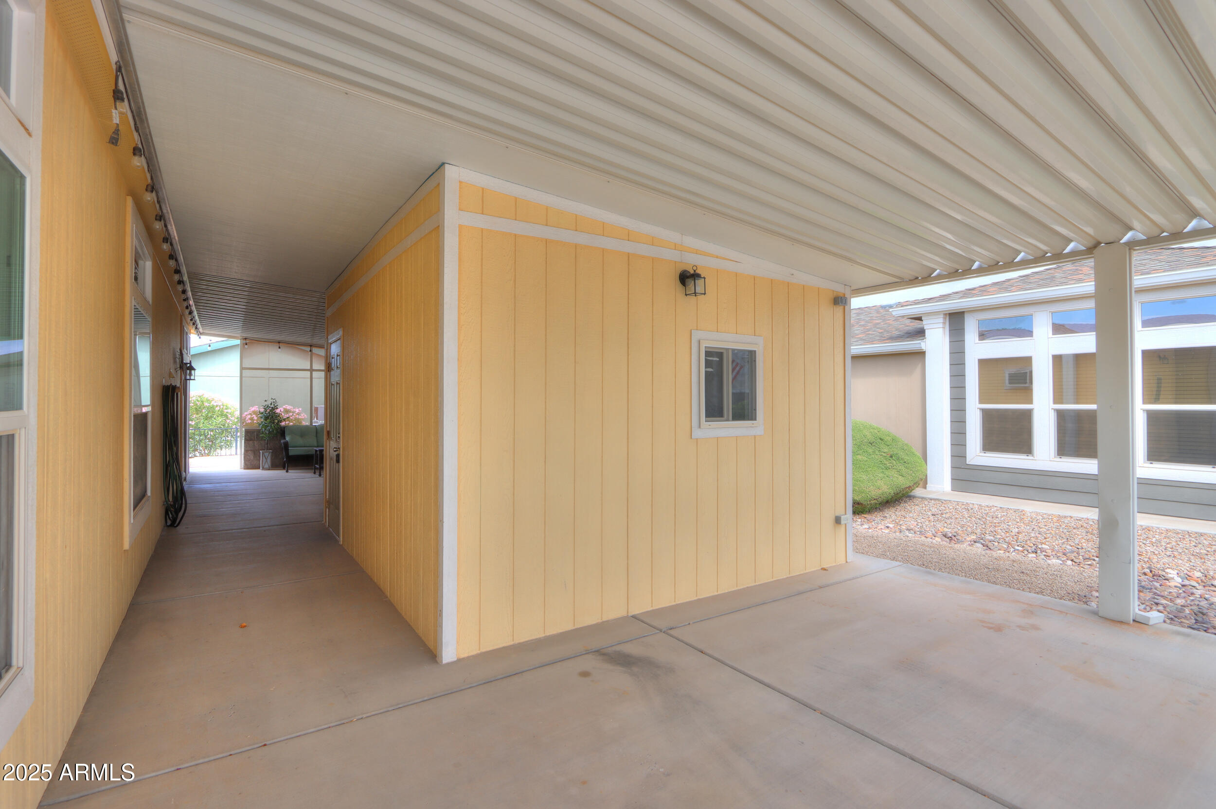 2263 North Trekell Road, Unit 36 Casa Grande, AZ 85122 - Photo 26 of 53 a view of a porch with wooden floor and a window