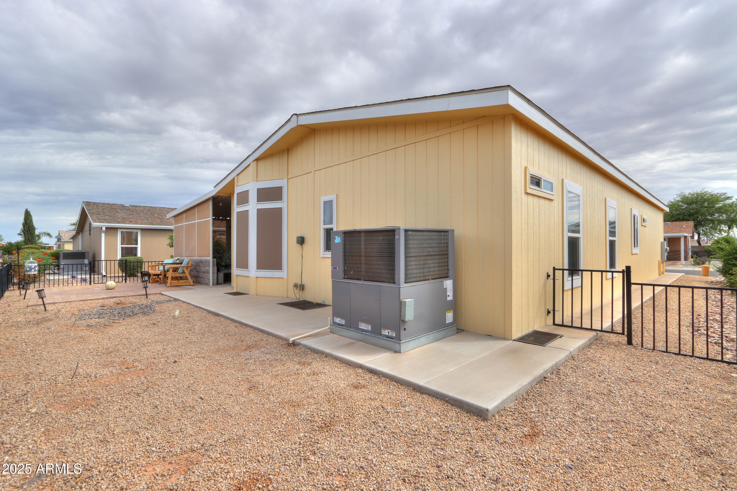2263 North Trekell Road, Unit 36 Casa Grande, AZ 85122 - Photo 29 of 53 a view of a house with backyard and porch
