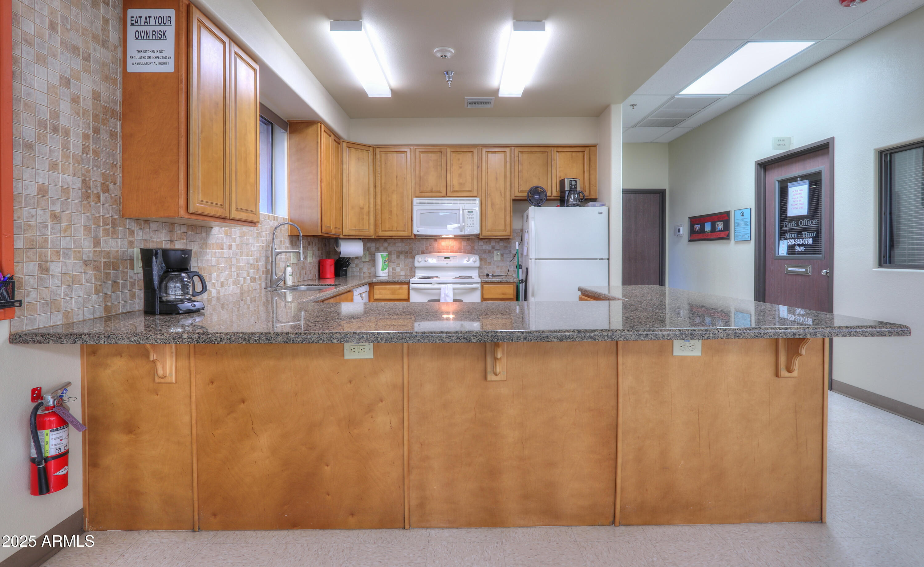 2263 North Trekell Road, Unit 36 Casa Grande, AZ 85122 - Photo 39 of 53 a kitchen with stainless steel appliances granite countertop wooden cabinets a sink and dishwasher