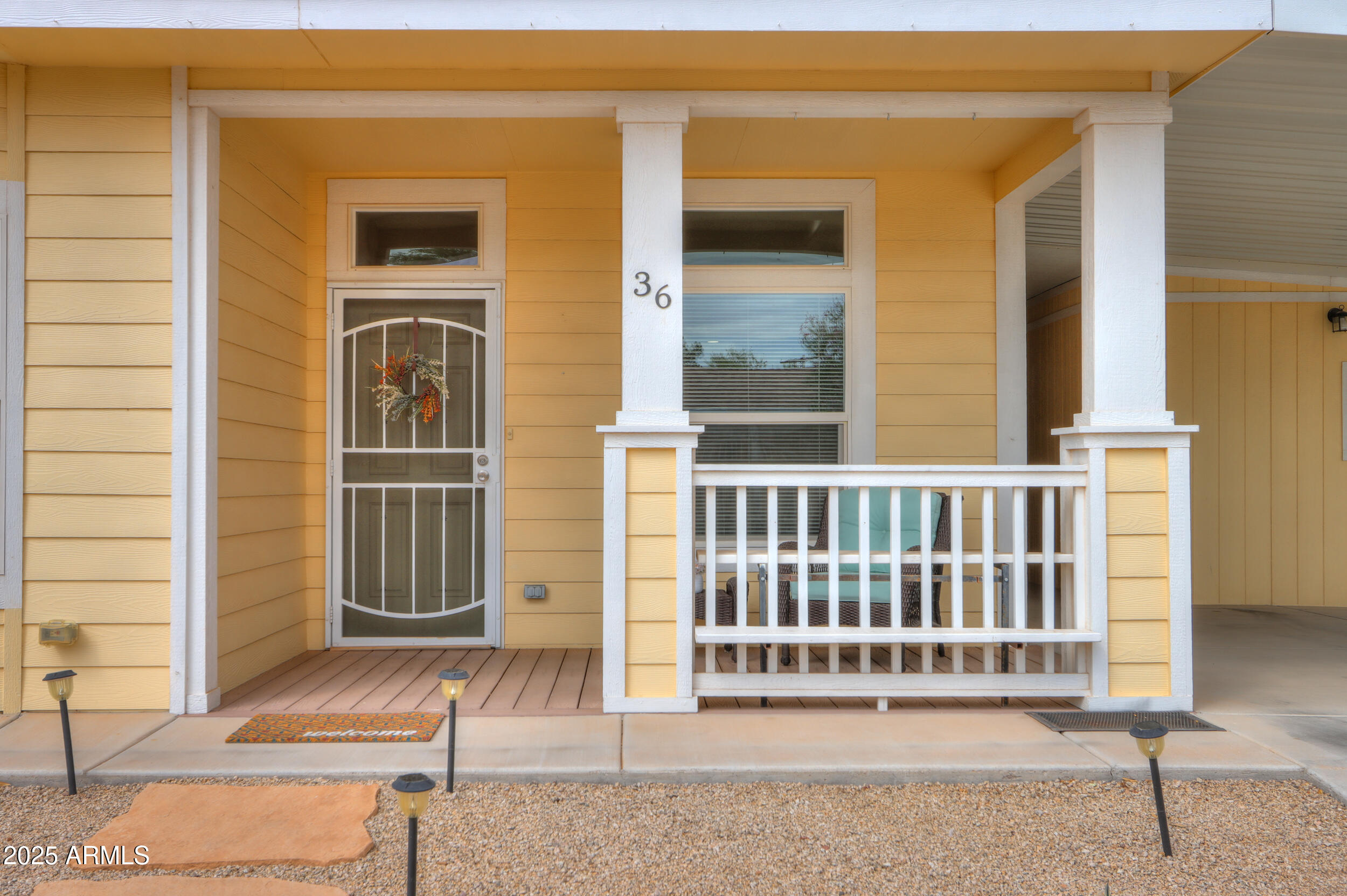 2263 North Trekell Road, Unit 36 Casa Grande, AZ 85122 - Photo 4 of 53 a front view of a house with a porch