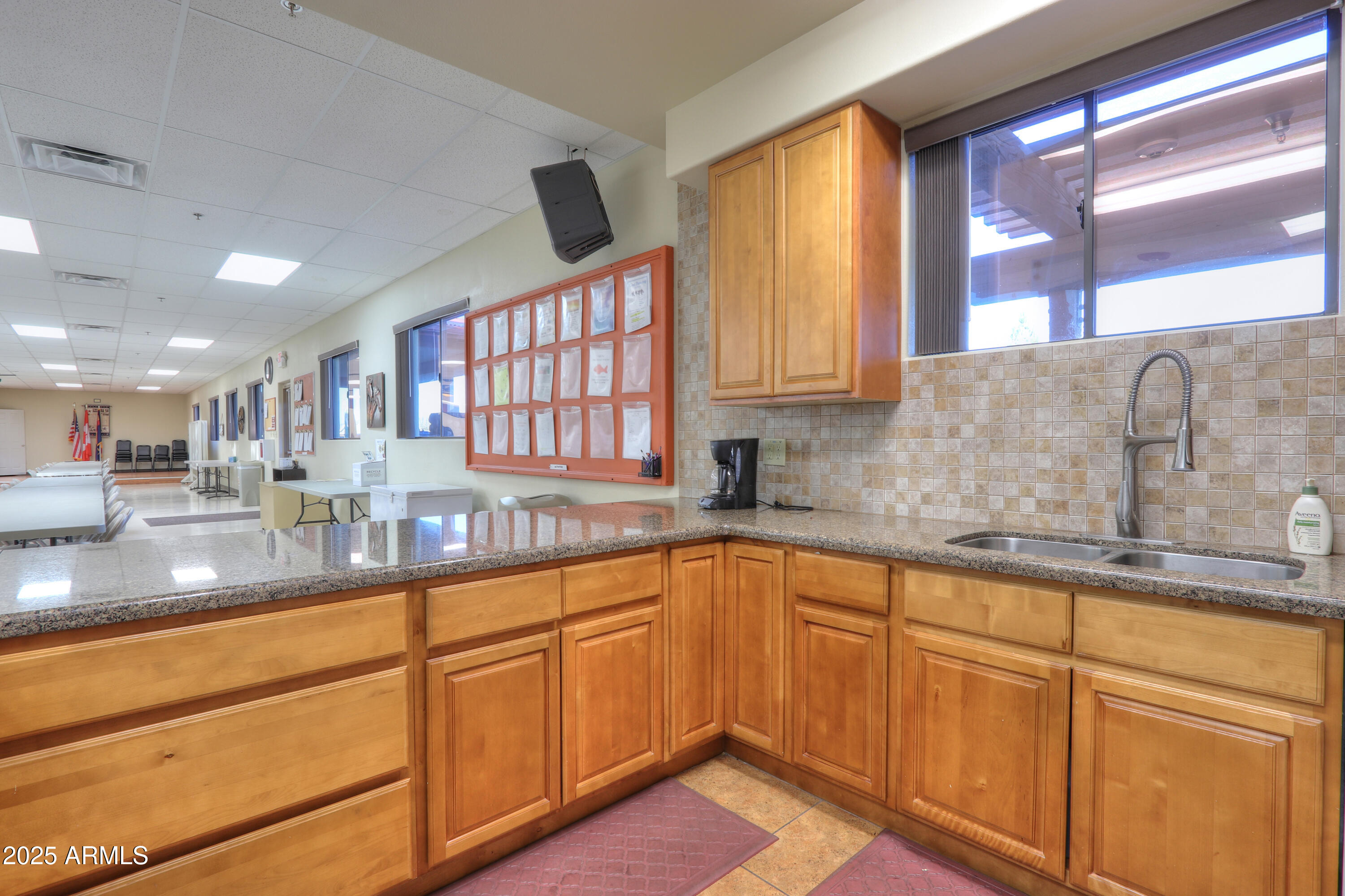 2263 North Trekell Road, Unit 36 Casa Grande, AZ 85122 - Photo 42 of 53 a kitchen with stainless steel appliances granite countertop a sink and cabinets