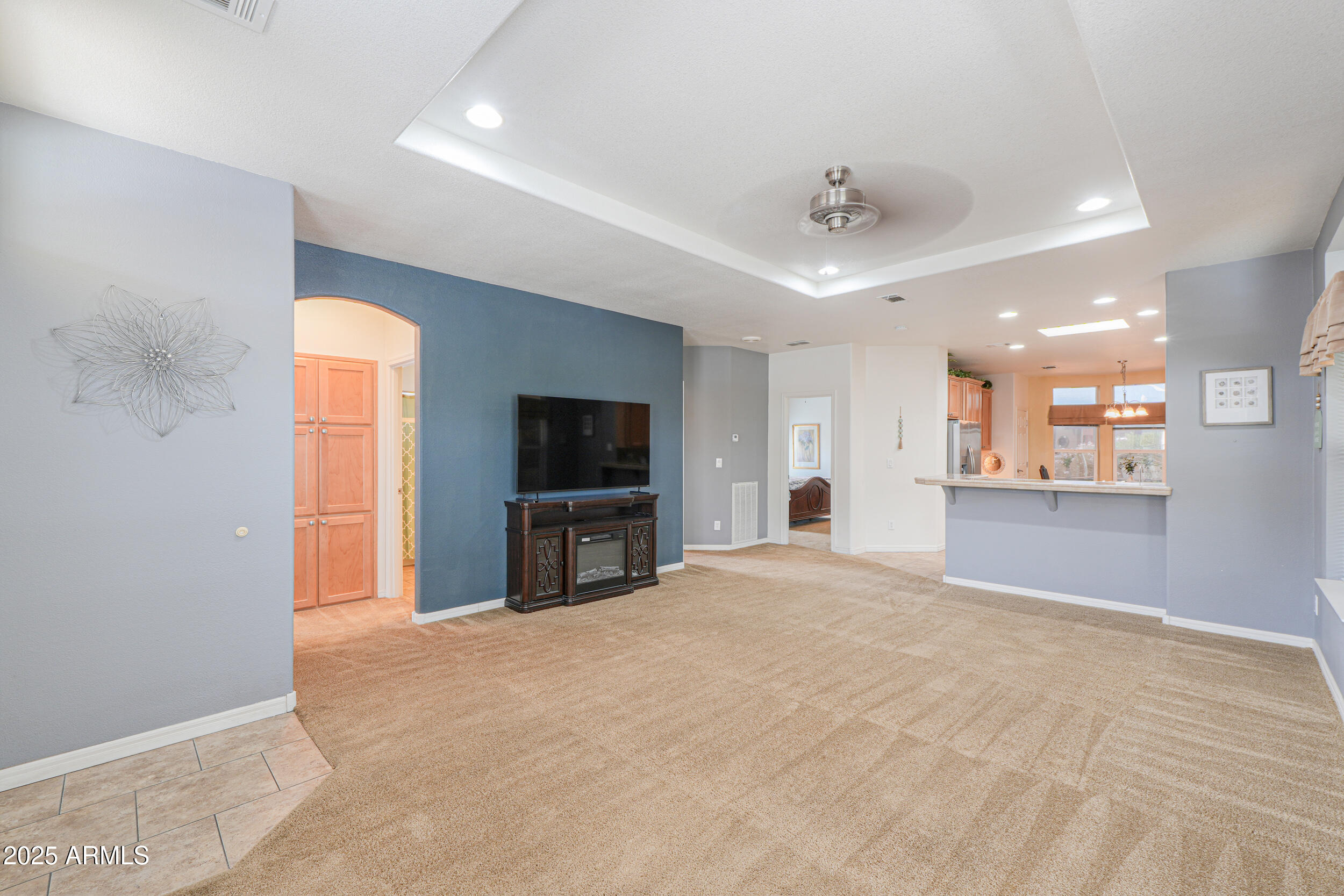 2263 North Trekell Road, Unit 36 Casa Grande, AZ 85122 - Photo 9 of 53 a view of a livingroom with a flat screen tv