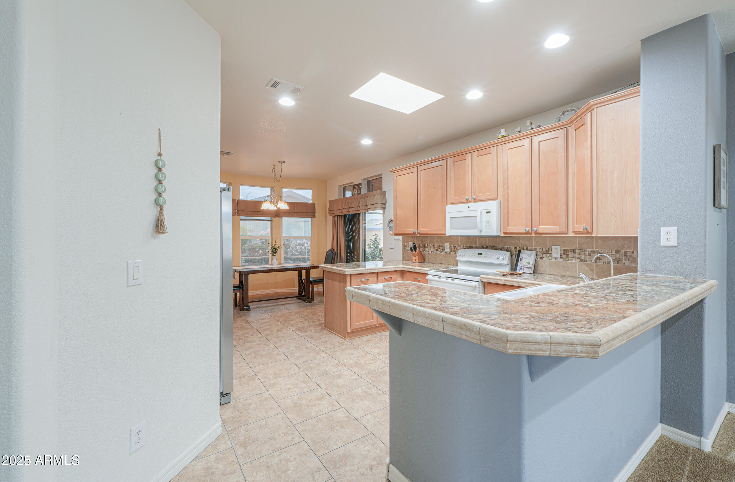 2263 North Trekell Road, Unit 36 Casa Grande, AZ 85122 - Photo 10 of 53 a kitchen with a sink stove and cabinets