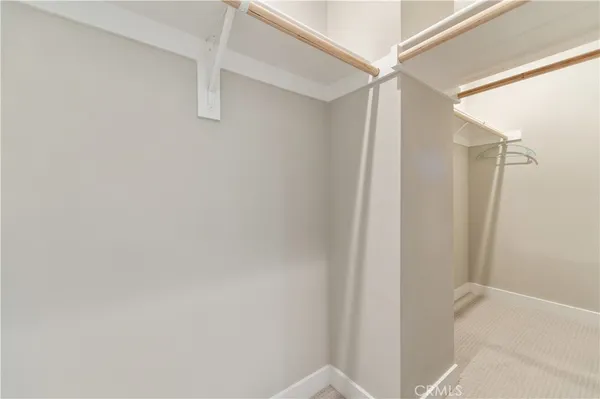 a bathroom with a sink and mirror with toilet
