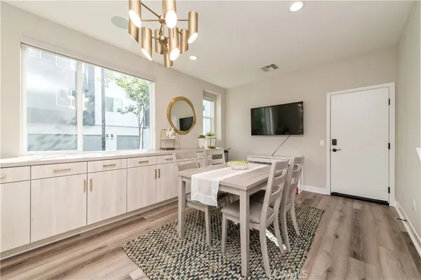 a large white kitchen with a large window
