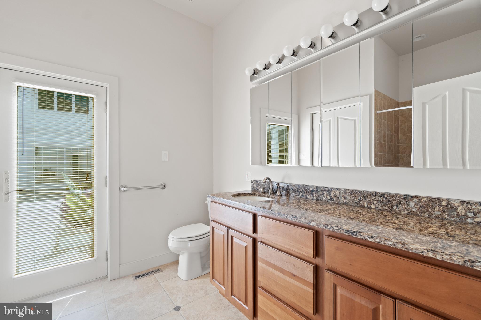 607 Friendship Road North Beach, MD 20714 - Photo 39 of 79 Main level full bath with access to the pool
