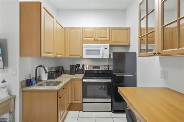 a dining room with chairs and a table