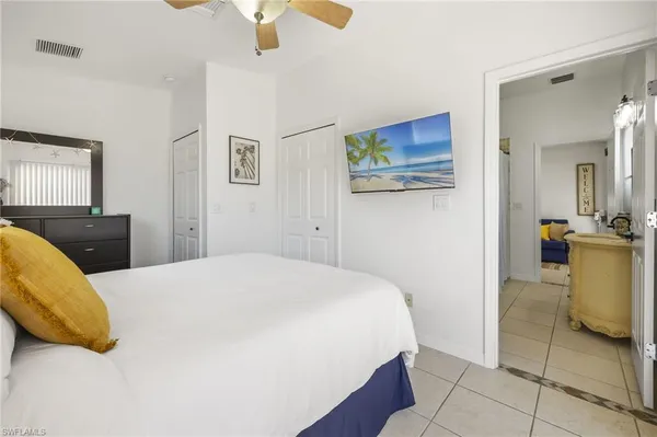 a bathroom with a granite countertop sink a toilet and a mirror