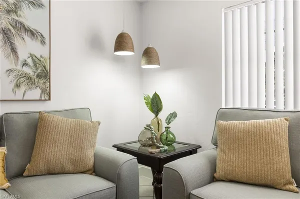 a view of a room with wooden floor and windows