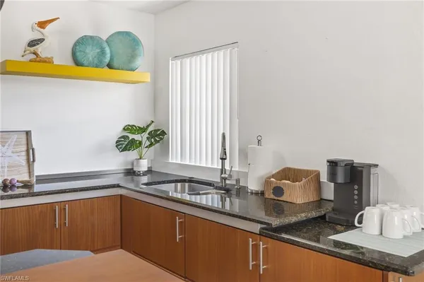 a kitchen with sink and window