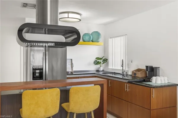 a kitchen with a sink and a stove