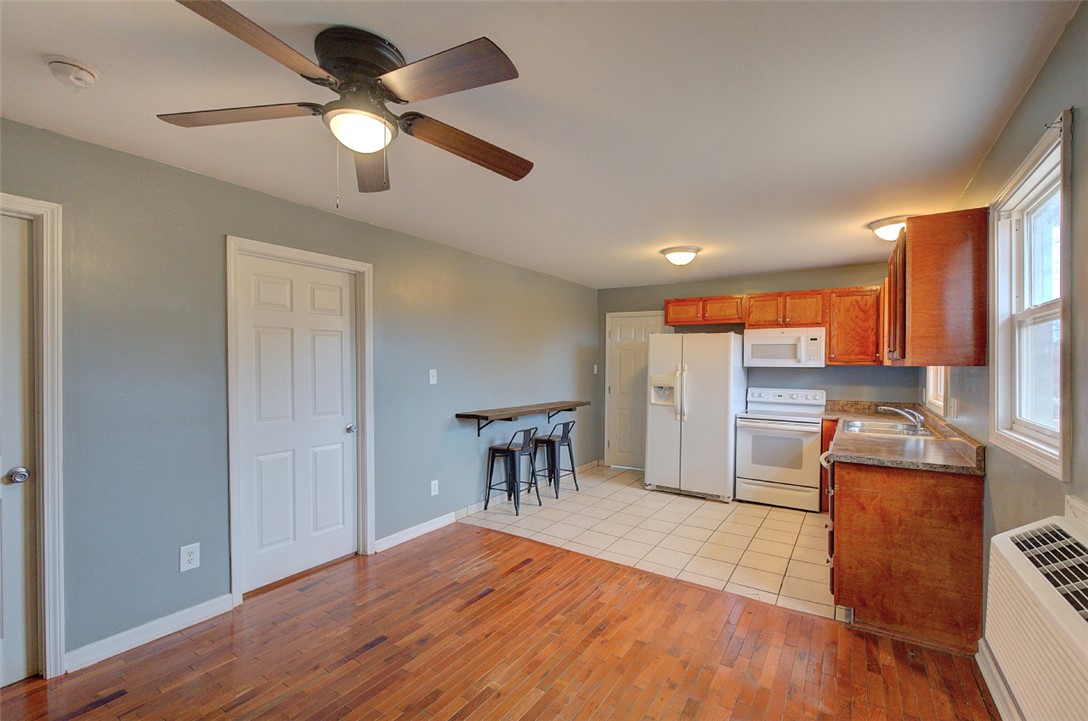 325 Rock Quarry Road Travelers Rest, SC 29690 - Photo 11 of 37 This spacious kitchen offers a functional layout with classic wood cabinetry and modern appliances.